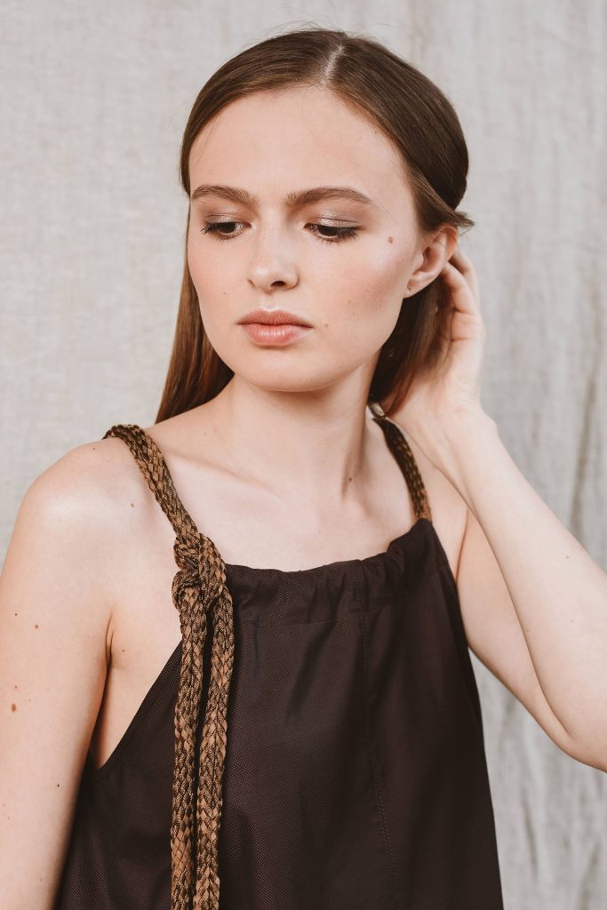 a woman wearing a brown dress