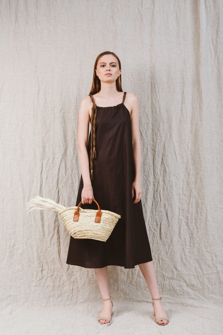 a woman wearing a brown dress